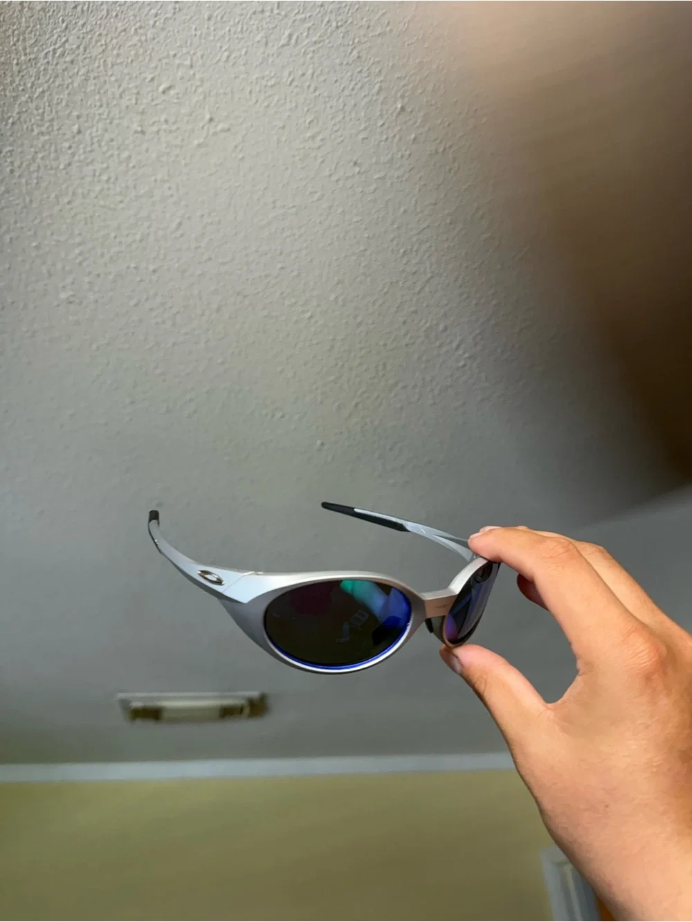 Silver Frame Sunglasses with Mirrored Blue-Green Lenses Oakley